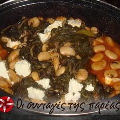 A picture of Giant beans in the oven with spinach.