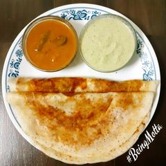 A picture of Tuppa Dosa with Podi.