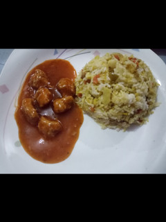 A picture of Fried Rice With Chicken Manchurain.