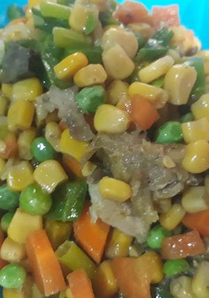 A picture of Stir fry vegetables with shredded chicken.
