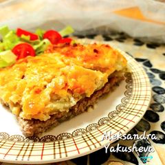 A picture of Pork chops with potatoes in the oven.