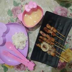 A picture of Sate saus yakult.