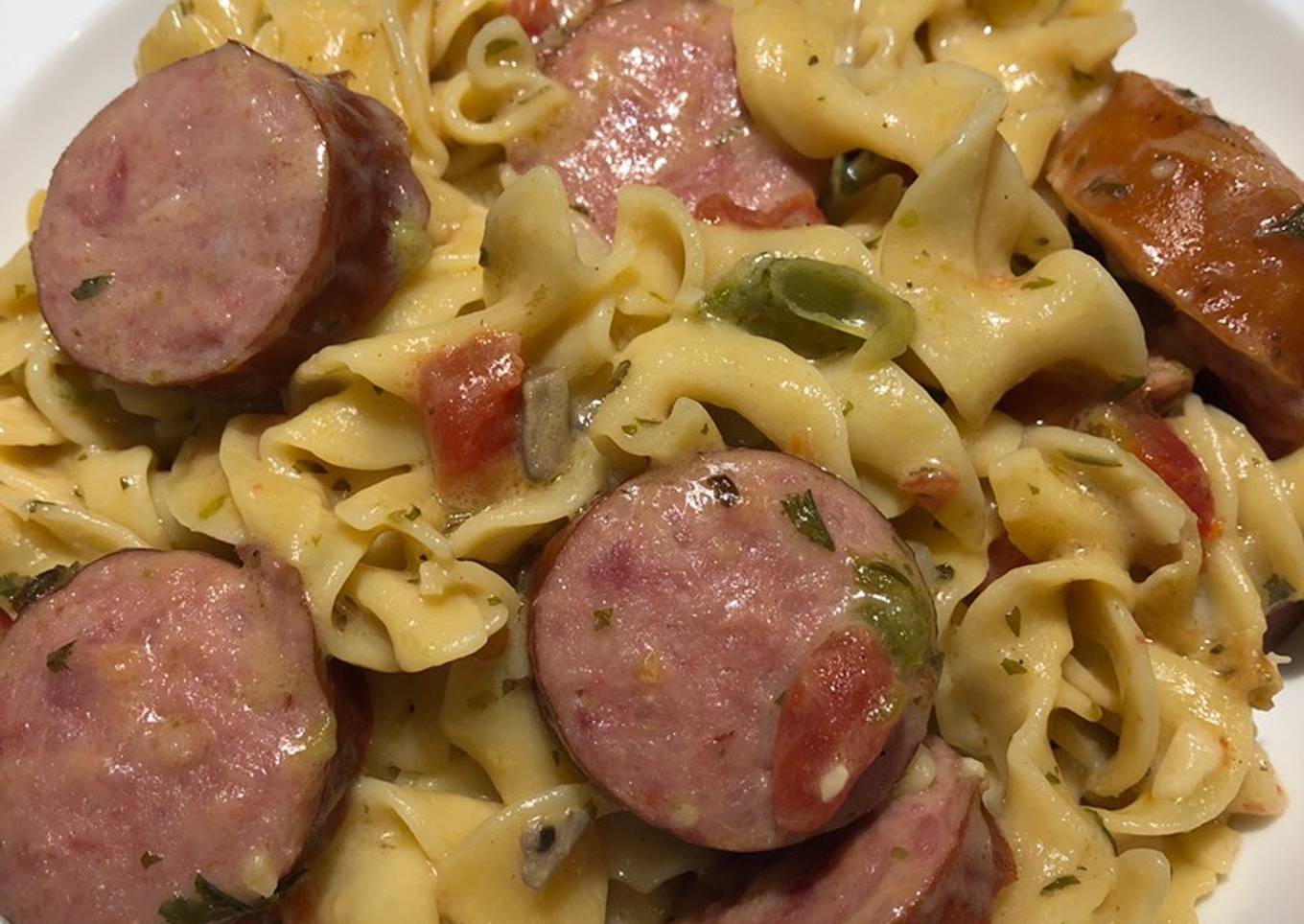 A pot of smoked sausage noodles