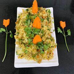 A picture of Veg rice pulao from left over rice.