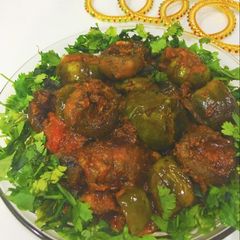 A picture of Stuffed mushroom baingan masala.