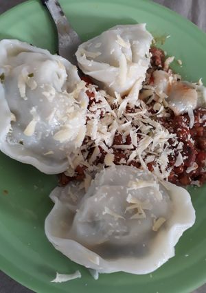 Una foto de Sorrentinos con tapas de empanadas