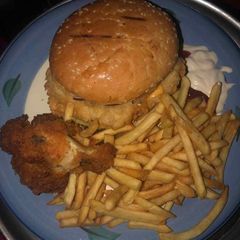 A picture of Potato chips with chicken and burger.