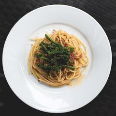 A picture of Pasta with kale and corned beef.