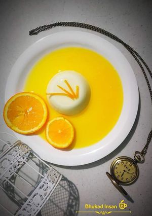 A picture of  Pannacotta with fresh orange .