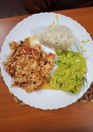 A picture of Ugali and Fried Eggs served with Guacamole.