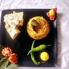 A picture of Tangy Tomato pulav best recipe for leftover rice.