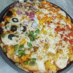 A picture of Rainbow pizza 🌈 🍕🍕.