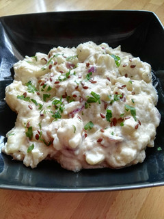 Una foto de Coliflor al curry con salsa de queso