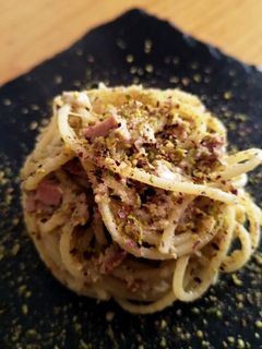 A picture of Spaghetti with Mortadella and Pistachio Cream.