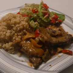 A picture of Beef picatta with brown rice and quinoa and a side salad.