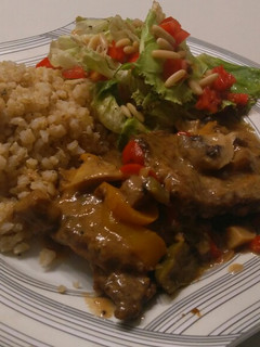 A picture of Beef picatta with brown rice and quinoa and a side salad.