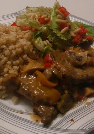 A picture of Beef picatta with brown rice and quinoa and a side salad.
