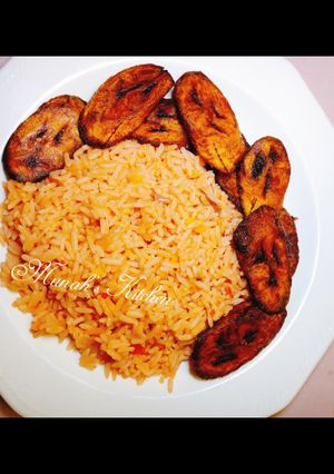 A picture of Simple jollof rice/ fried plantain.
