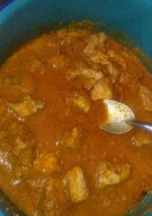 Una foto de Carne de puerco en salsa con Arroz