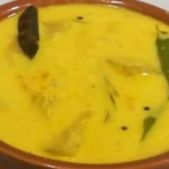 A picture of Poosanikai Mor Kuzhambu/ Ash Gourd Buttermilk Curry.
