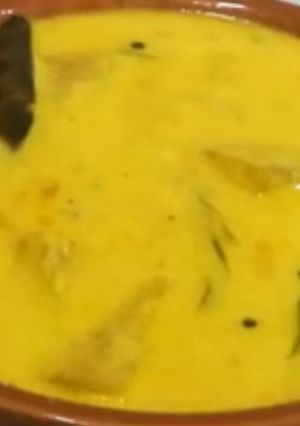 A picture of Poosanikai Mor Kuzhambu/ Ash Gourd Buttermilk Curry.