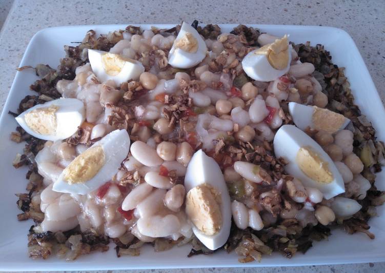 Ensalada templada de legumbres en cama de cebolla y puerro