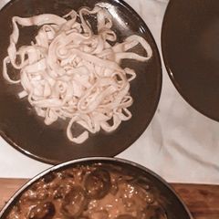 A picture of Fresh pasta and meat balls.