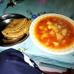 A picture of Potato stew and chapati for one.