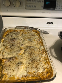 A picture of Smothered broccoli and rice pork chop.