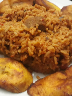 A picture of Jollof rice and fried plantain.
