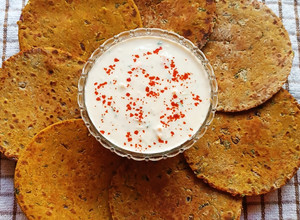 A picture of Jowar Bhakri With Vegetables. (Accompanied With Cucumber, Carrot Raita).