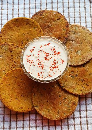 A picture of Jowar Bhakri With Vegetables. (Accompanied With Cucumber, Carrot Raita).