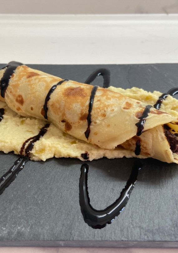 Una foto de Crep de morcilla con manzana y cebolla caramelizada