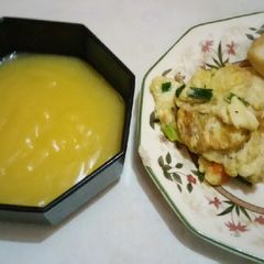 A picture of Toasted bread and egg served with sweet creamy custard.