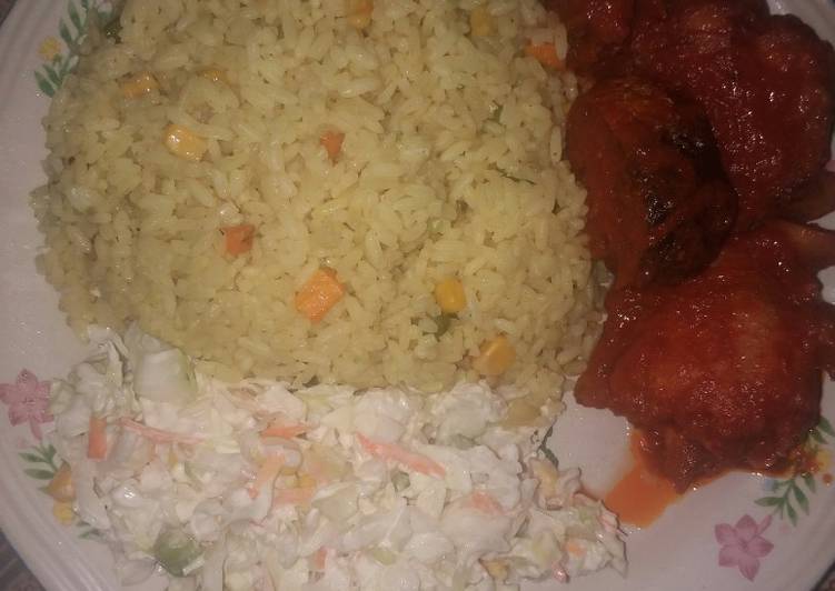 Fried rice and salad with sauced fried turkey and mackerel fish