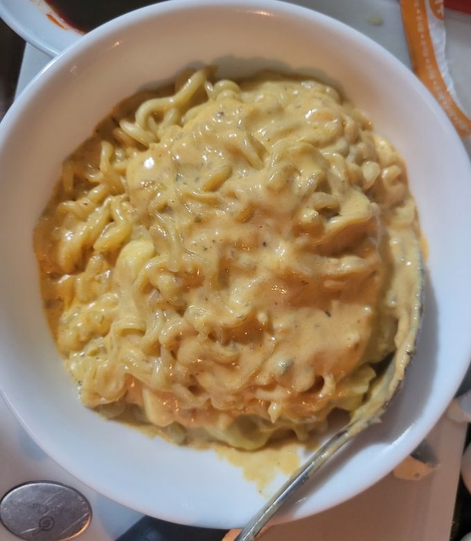 A picture of Samyang Chicken Cheese Noodle (Less Spicy Carbonara).