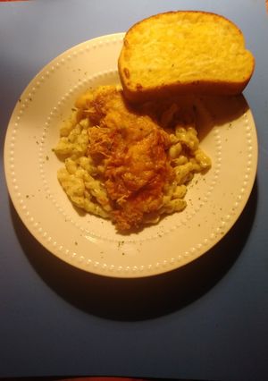 A picture of Crispy chicken cacciatore with pasta alfredo.