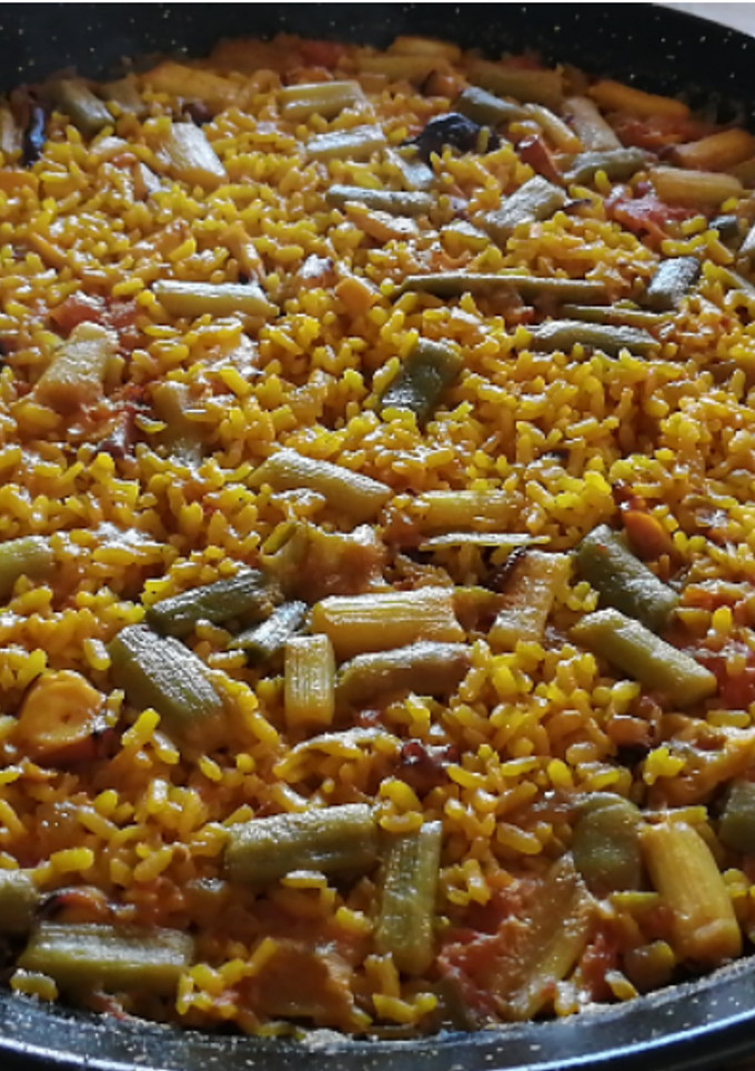 Una foto de Arroz con pulpo y ajetes