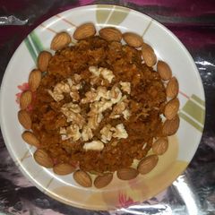 A picture of Carrot halwa with walnut topping.