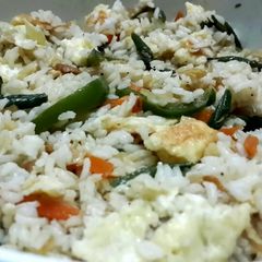 A picture of Stir fried egg and mixed veg fried rice.