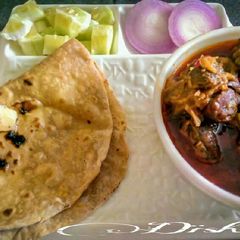A picture of Warli style mutton curry.