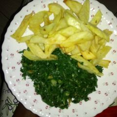 A picture of Home made fries & spinach.