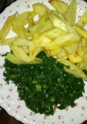 A picture of Home made fries & spinach.