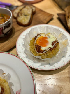 A picture of North African Baked Eggs with Spaghetti.