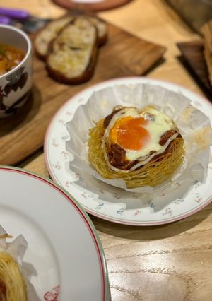 A picture of North African Baked Eggs with Spaghetti.