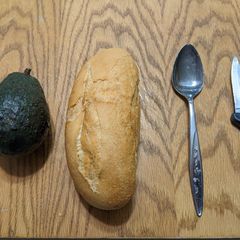 A picture of Avocado on a bun.