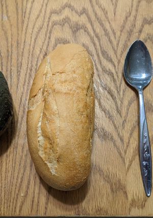 A picture of Avocado on a bun.