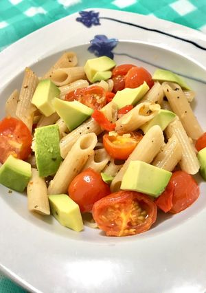 A picture of Aglio olio with Avocado and Cherry Tomatoes.