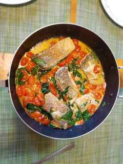 A picture of Salmon with Cheese, Spinach and Tomatoes.