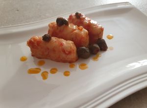 Foto di Filetti di nasello in umido con capperi e olive